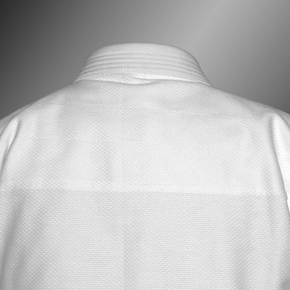 Back view of the QTBU-001 BJJ gi jacket showing clean, seamless back construction perfect for large academy patches