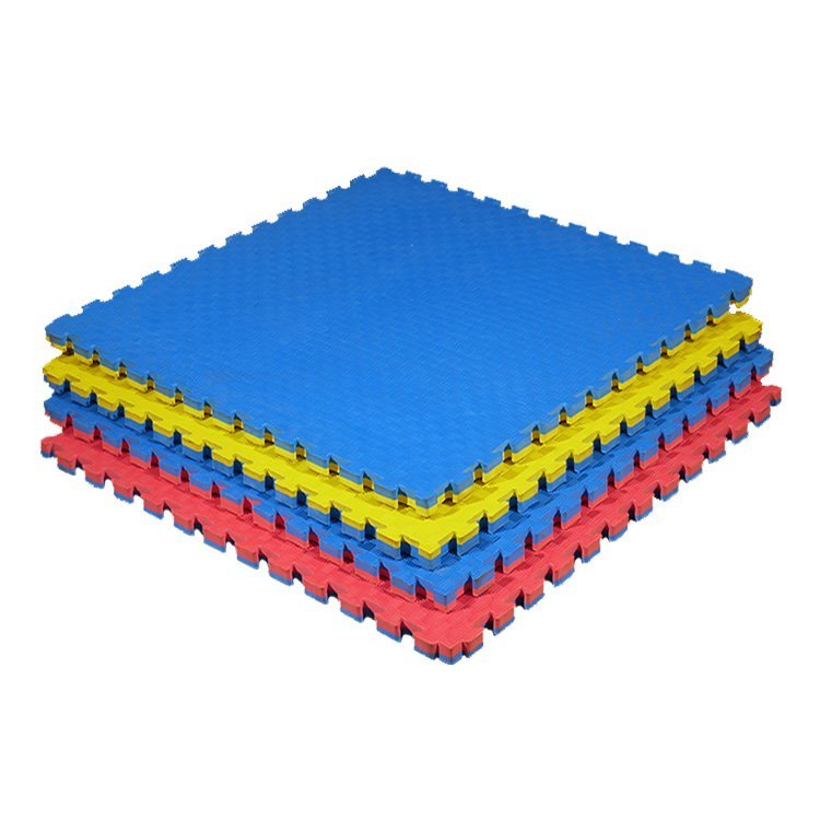 EVA foam tatami mats installed across a modern dojo training floor